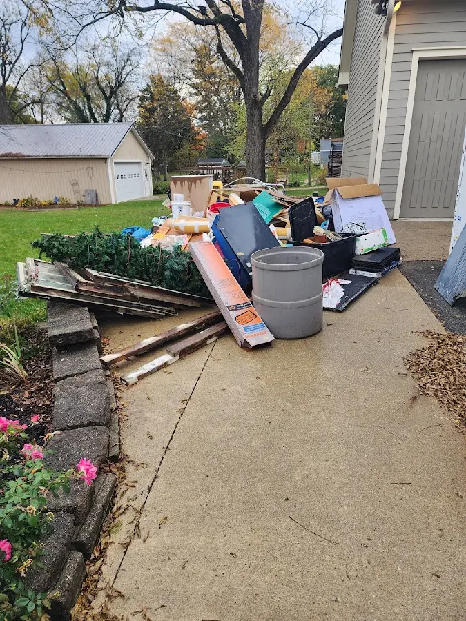 Dumpster being loaded with debris for Demolition Dumpster Rental in Enfield
